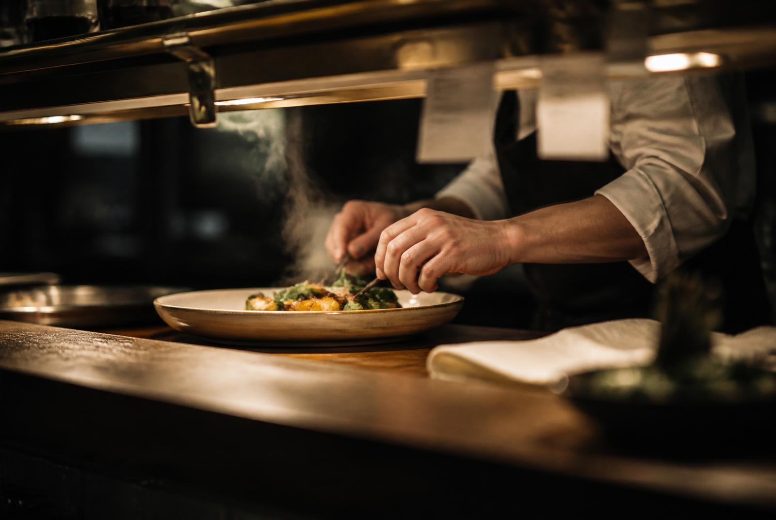 Chef at the kitchen pass during service